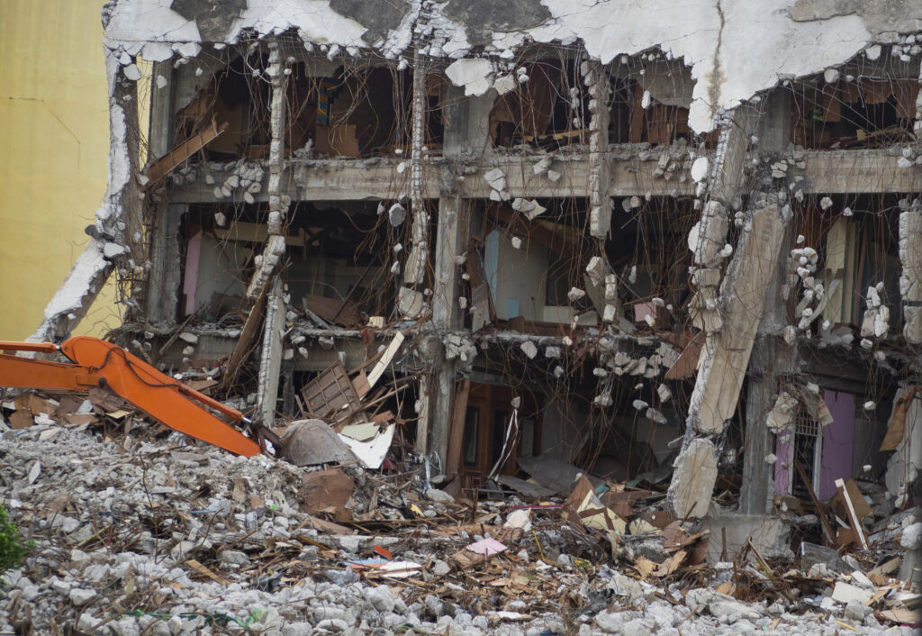 destroyed building industrial. building demolition by explosion.